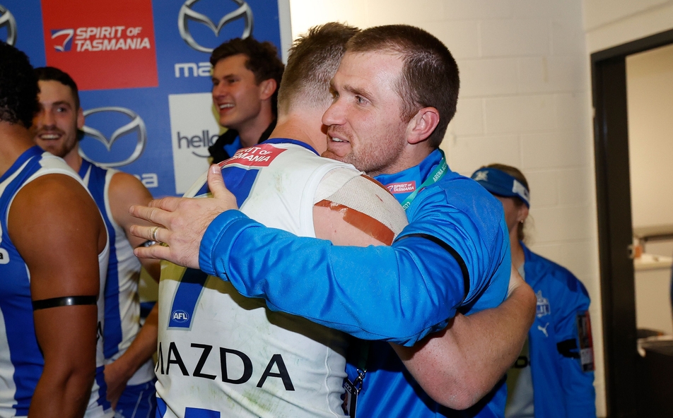Jack Ziebell and Leigh Adams embrace after North Melbourne's win over Richmond in round 18, 2022. Picture: AFL Photos